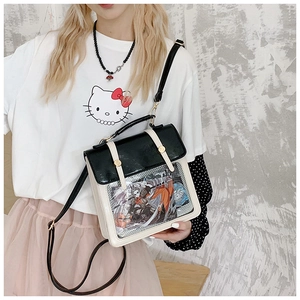 Macro detail of the white ita bag with clear PVC window and black patent leather flap