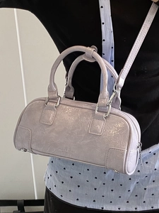 Lavender purple patent leather bowling bag with top handles and detachable shoulder strap