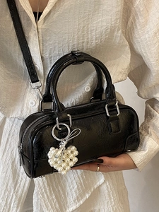 Minimalist black patent leather bowling bag with heart pearl charm and silver hardware