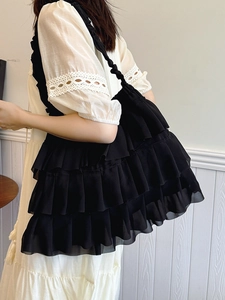 Black tiered ruffle tote bag with ballet style aesthetic and layered chiffon design