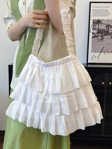 Chic white multi-layered ruffle tote bag with tiered cake-skirt design and gathered shoulder strap