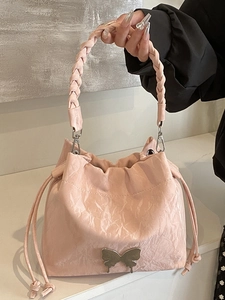 Pink pleated bucket bag with silver butterfly charm and braided top handle for women