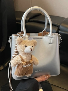 Silver oil-wax leather bucket bag with cute bear charm and adjustable shoulder strap