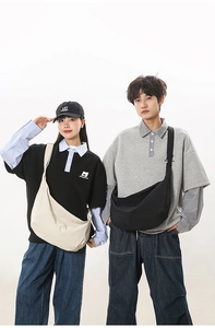 Detailed comparison of beige and black nylon crescent crossbody bags worn by models