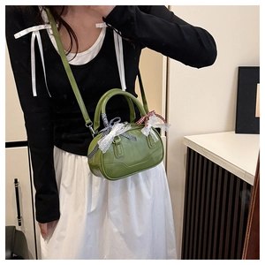 Mini grass green Boston bag with lace and checkered ribbon detail on handle