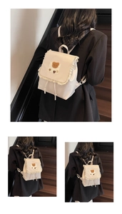 Detail of sweet cream backpack with lace ruffles and a cute plush bear patch