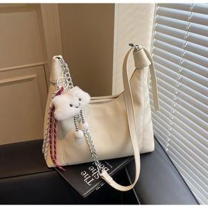 Detail of off-white lychee texture tote bag with silver chain and cute cloud charm