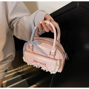 Pink sweet-style handbag with bow detail, white lace trim and checkered handle grip