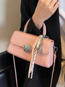 Pink patent leather rectangular handbag with silver metal handle and shoulder strap