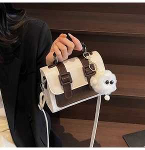 British vintage satchel in cream and dark brown faux leather with plush ball charm