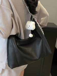 Black pebble leather tote bag with silver chain and white cloud charm for women