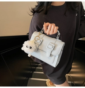 British vintage school style satchel bag in light blue with cute monster plush pendant