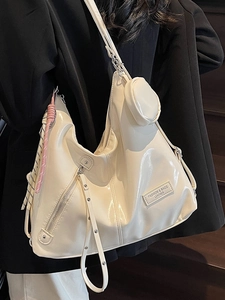 Glossy off-white leather hobo tote bag with a small round pouch and silver hardware
