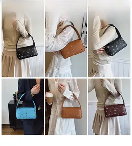 Model wearing various colored underarm bags with stylish hollow metal rivet details