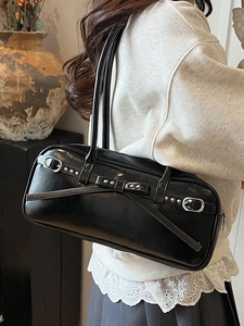 French vintage black leather underarm bowling bag with silver studs and bow decoration