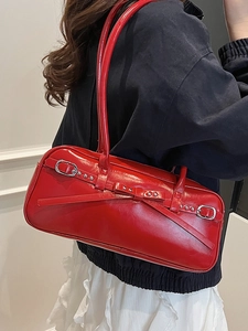 Vintage red leather underarm bowling bag with bow element and silver metal buckle