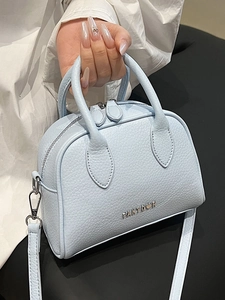 Light blue lychee texture Boston handbag with crossbody strap and silver logo