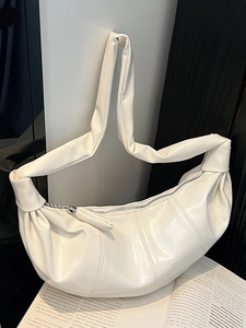 Minimalist cream-white crescent shoulder bag with pleated soft leather texture