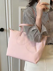 Pink nylon tote bag for women showing large capacity and stylish commuting shoulder style