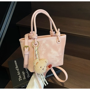 Pink gradient cloud pattern bucket bag with cute brown plush bear charm detail
