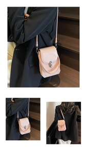 Close-up of pink leather phone bag with woven texture and elegant metal lock