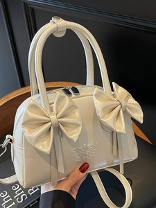 Sac Boston crème avec design de nœud 3D élégant et poignées supérieures pour femme