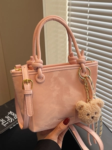 Pink marble pattern bucket bag with knot handle and plush bear charm for women