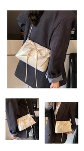 Three-angle view of a cream ballet-style crossbody bag with a large decorative bow