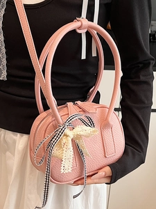 Pink lychee texture bowling bag with lace bow decoration and checkered ribbon straps