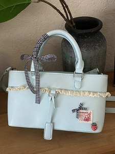 Sweet light blue PU leather handbag with lace trim and strawberry pendant for women