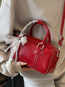 Red glossy mini bowling bag with bow decoration and checkered lace ribbon detail