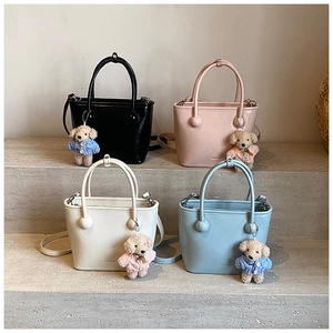 Minimalist square bucket bags in black, pink, beige, and blue with cute bear charms