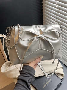 Silver ballet-style bow shoulder bag with metallic leather and chain strap for women