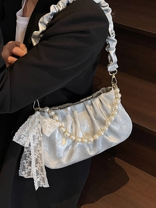 Silver satin pleated underarm bag with pearl chain and lace bow charm detail