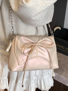 Chic ballet style champagne satin shoulder bag with oversized bow and chain strap