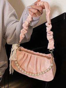 Pink pleated dumpling handbag with pearl chain and lace bow detail for women