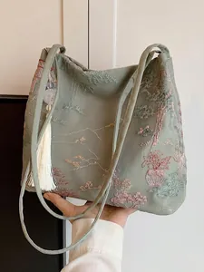 Sac cabas brodé de style chinois élégant en soie verte avec détails de pompons