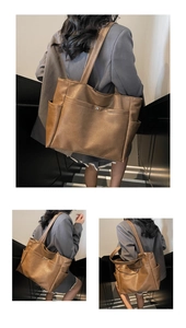 Macro shot of large brown tote bag showing soft leather texture and metal snap pockets