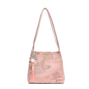 Elegant pale pink Chinese style bucket bag with traditional embroidery and tassel charm
