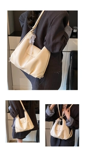 Detail view of cream lychee leather tote with pearl charms and lace bow accessories
