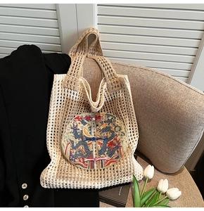 Close-up of traditional Chinese dragon embroidery and colorful buttons on woven tote bag