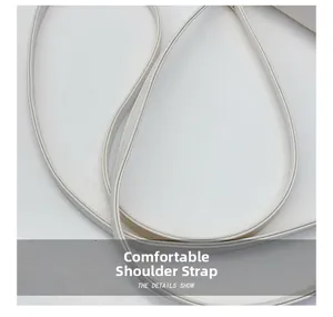 Close-up of comfortable white leather shoulder strap with neat stitching details