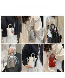 Detailed views of mini crossbody bags in white, silver, black, and red patent leather