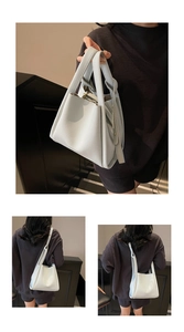 Detailed views of light grey lychee leather bucket bag with top handle and shoulder strap