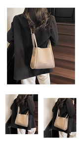 Beige lychee pattern leather tote bag shown on a model with long shoulder straps