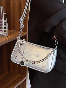Fashionable silver underarm bag with pleated texture and chunky chain strap for women