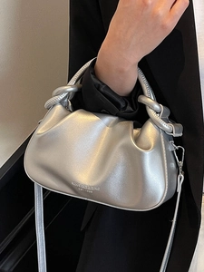 Silver pleated cloud bag with metallic finish and woven handle for women fashion