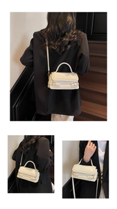 Detail view of the white leather square bag with gold hardware and stylish strap