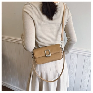 Brown litchi grain small square shoulder bag with silver metal buckle on elegant model