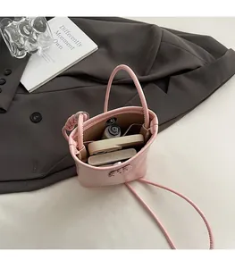 Pink pebbled leather bucket bag interior capacity for phone and lipstick